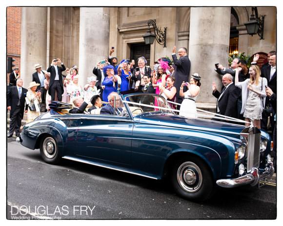 Wedding party with car in front of London church - wedding photograph