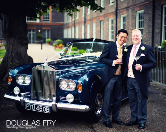 Couple with car and champagne in London