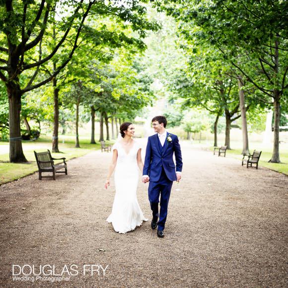 bride and groom walking outside at Gray's Inn photographed by Douglas Fry