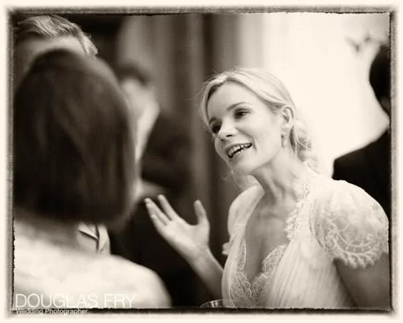 Wedding Photographer Two Temple Place - A Spectacular and Unusual London Venue 9 Bride pictured in conversation during wedding reception