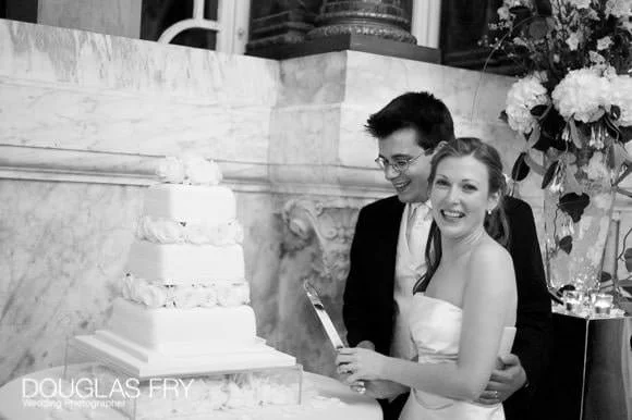 A Wedding at Dartmouth House in London 14 Cutting the cake during wedding in London