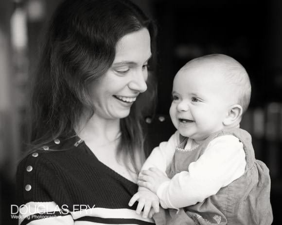 Smiling photograph of mother and baby in London