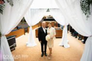 Bride and groom under Chuppah during jewish wedding ceremony in London