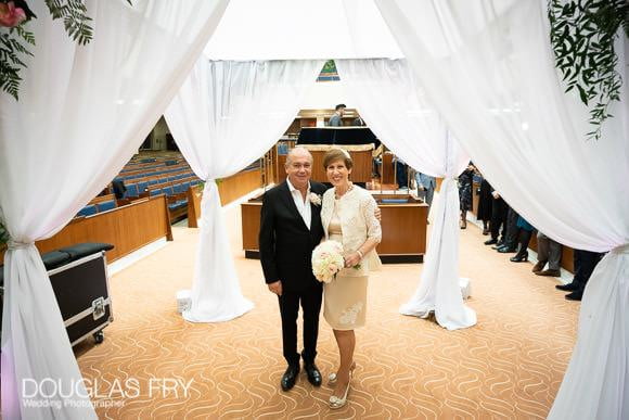 wedding photograph of the couple under the chuppah in London synagogue