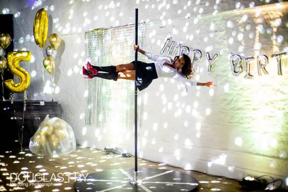 Photograph of pole dancing at party