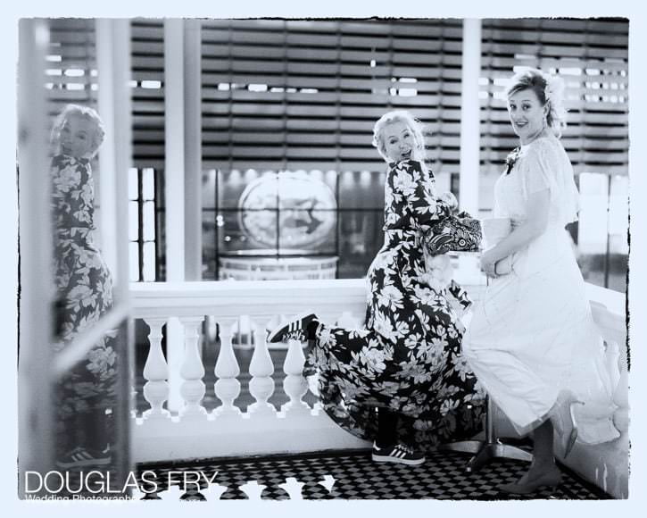 Two guests posing for a fun photograph on the balcony