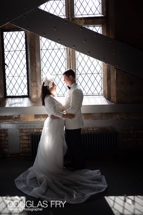 wedding couple photographed during their exchange of vows in Tower Bridge North Tower