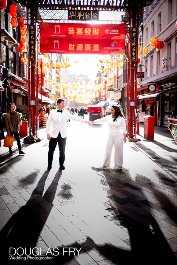 Sunny backlit wedding portraits of the wedding couple taken in Chinatown in London