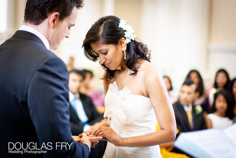 Syon Park Wedding Photography for Maddi & Stephen - Reprocessing of Photographs 1 syon park wedding ceremony - bride putting ring onto groom's finger
