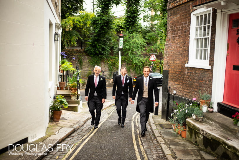 Groom and best men in Hampstead on way to wedding photographed by Douglas Fry wedding photographer