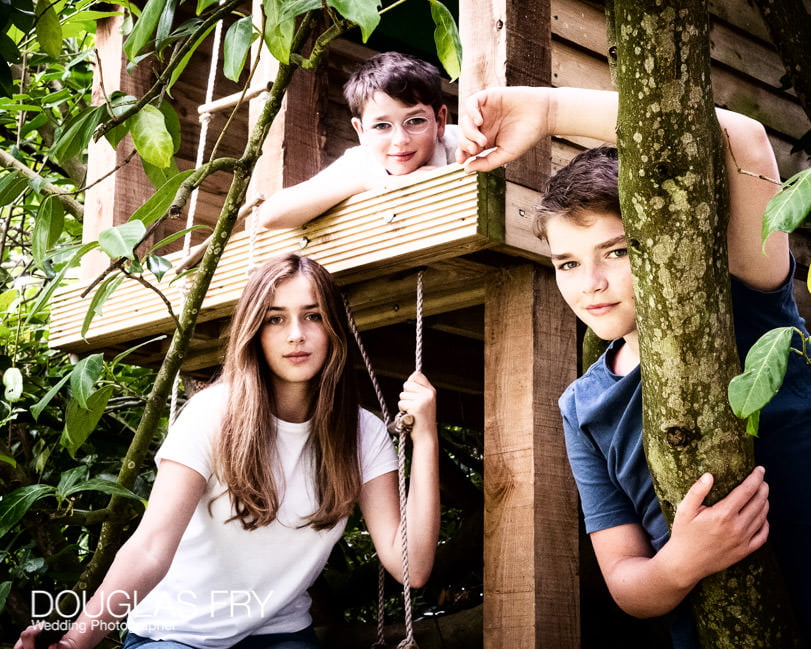 Teenage children and dog photographed at home in Wiltshire with Treehouse