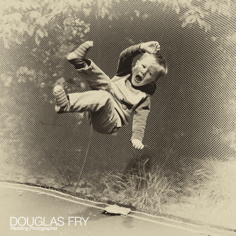 Trampoline photograph of child playing at home in Berkshire