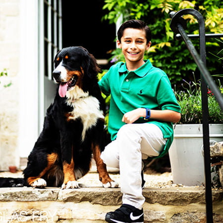 Son with dog photographed at home