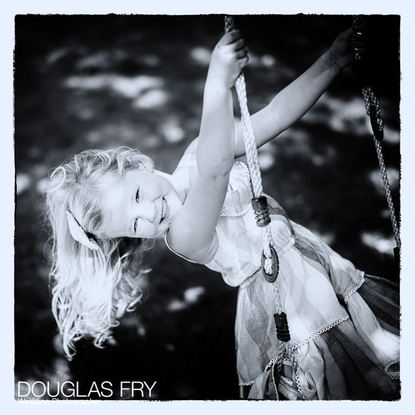 Girl photographed on garden swing