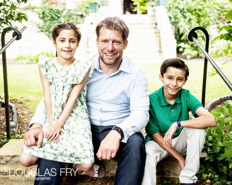 Father with children photographed in garden at home near Oxford - Islip