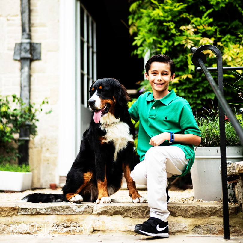 Boy photographed with the dog at home