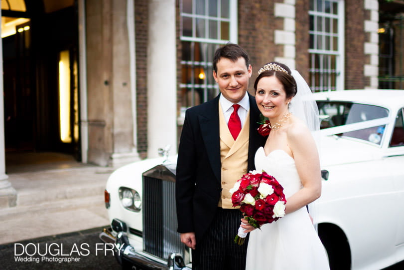 Bride and groom photographed in front of HAC in London