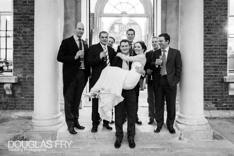 Bride with ushers and groom in front of HAC