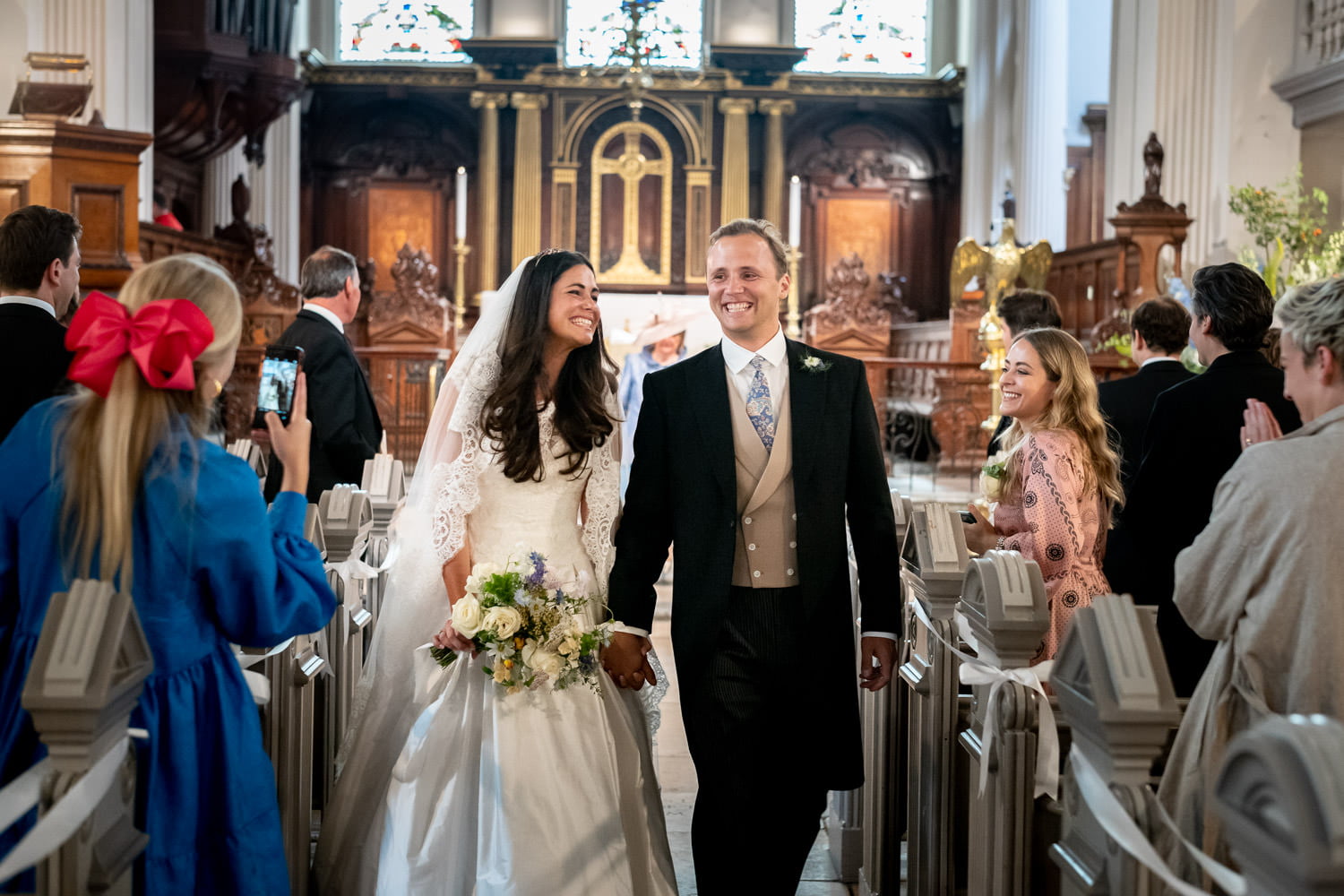 Bride and groom photographed in London church