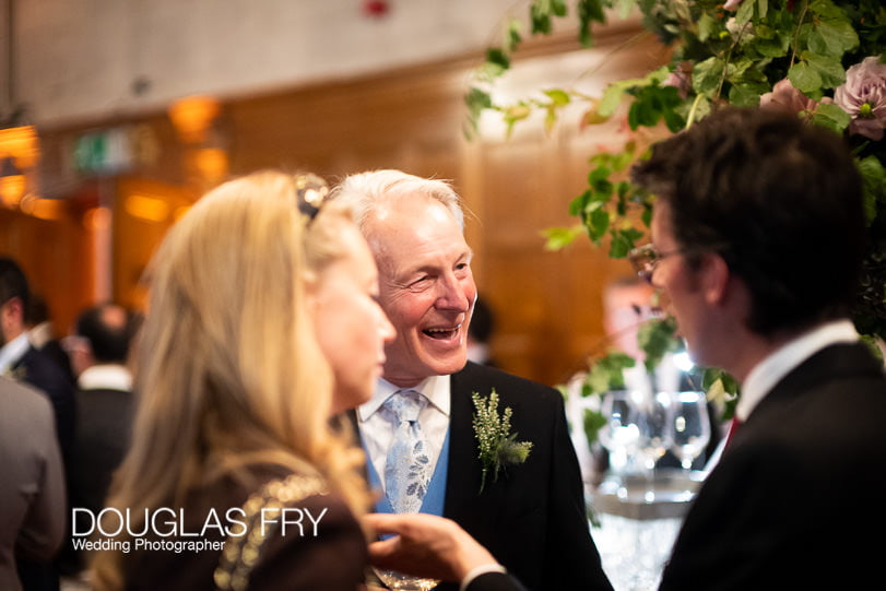 guests at wedding reception photographed with Leica Noctilux Lens in low light