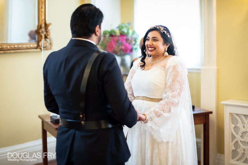 Photograph of couple exchanging vows in Chelsea Register Office