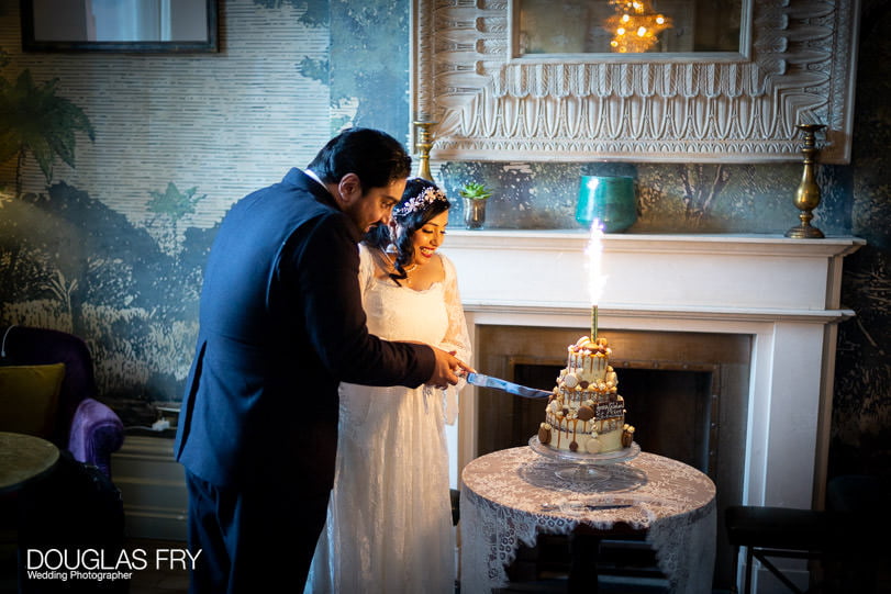 bride and groom cutting wedding cake at Hollywood Arms