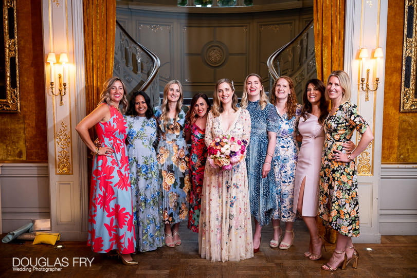 Bride photographed at wedding with friends