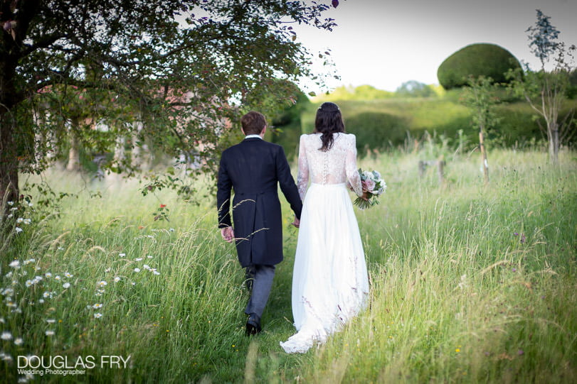 Romantic photograph of wedding - couple pictured in countryside