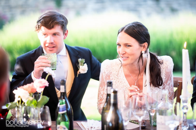 bride and groom photographed during wedding reception