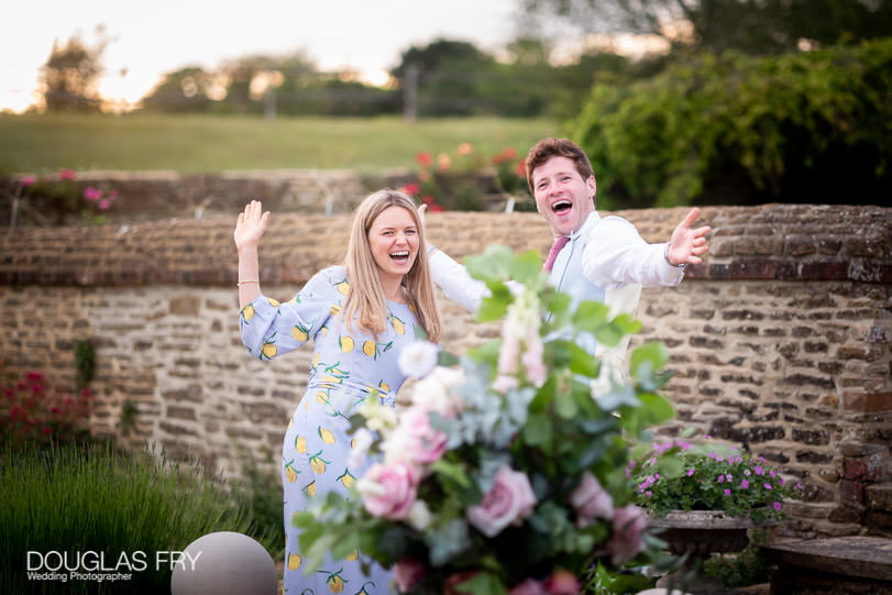 Guests in gardens during wedding