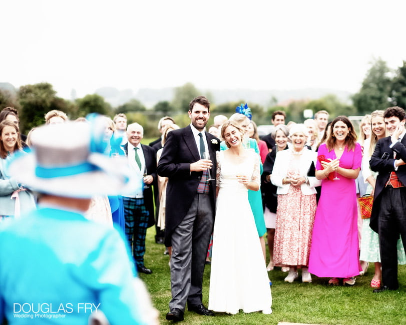 speaches photographed during wedding reception in marquee in field