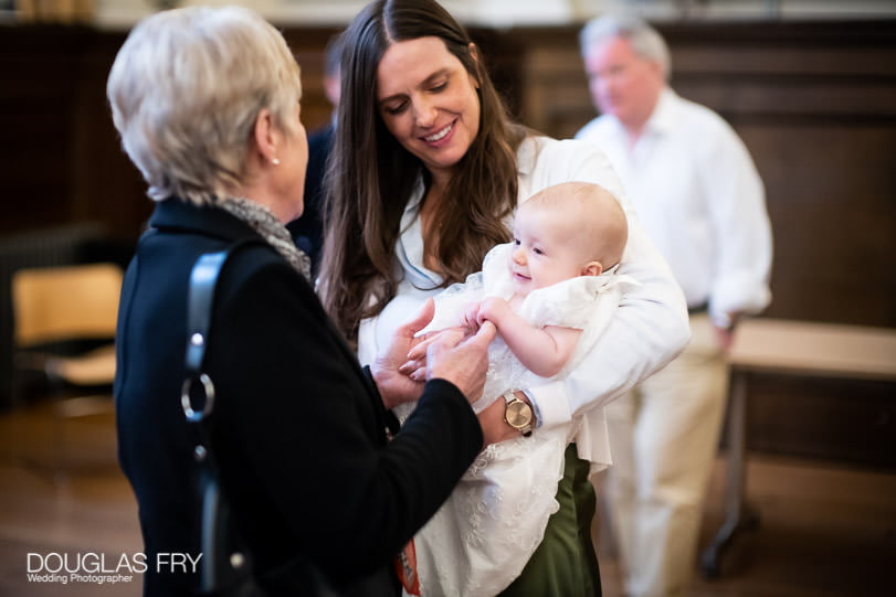 Baptism photographer at Farm Street Church in London - baby