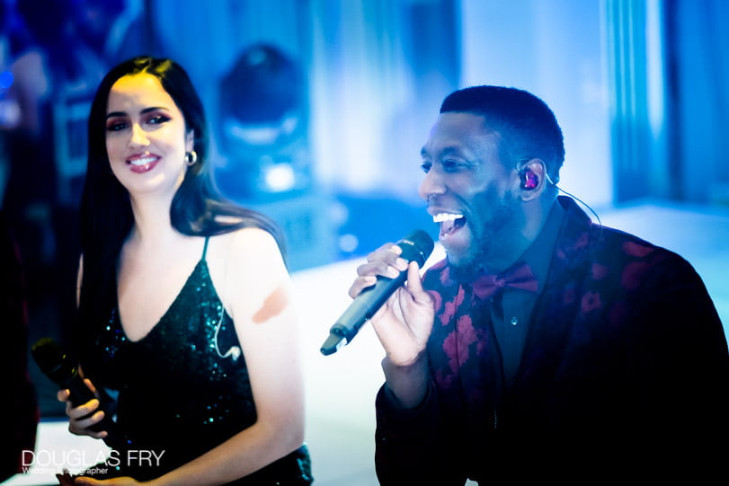 Wedding Photographer - Singer during reception at Claridge's Hotel in London