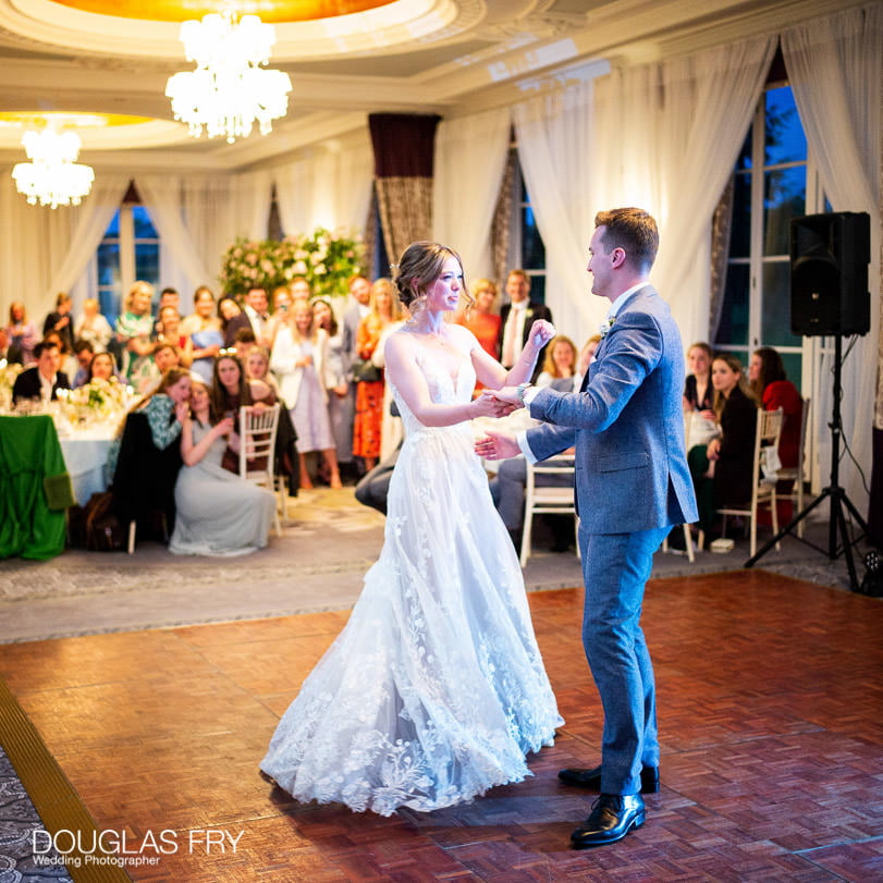 Bride and Groom wedding photograph dancing at RAC Woodcote Park in Epsom