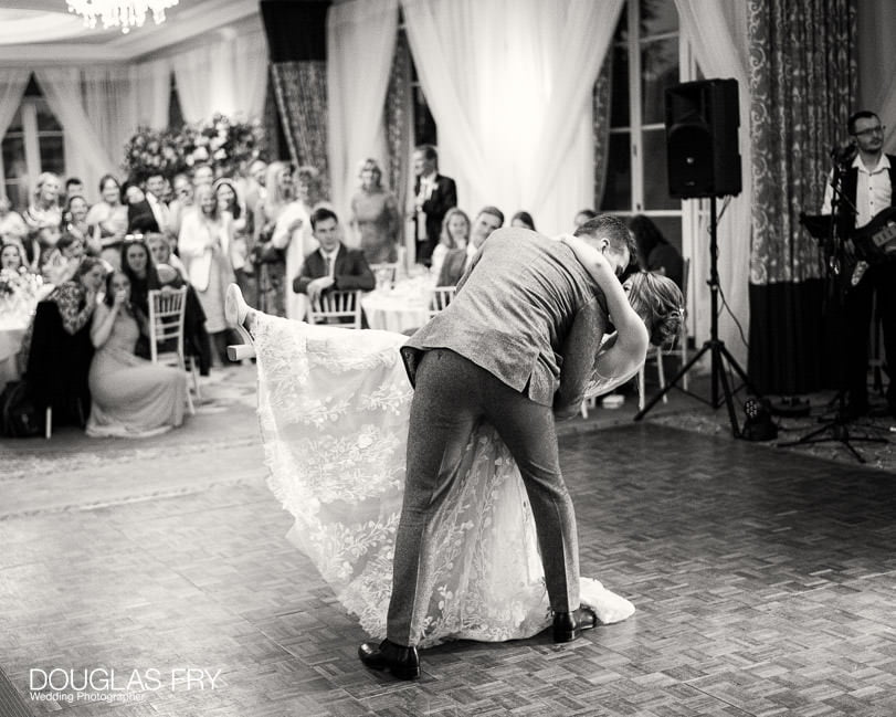 Bride and Groom wedding photograph dancing at RAC Woodcote Park in Epsom