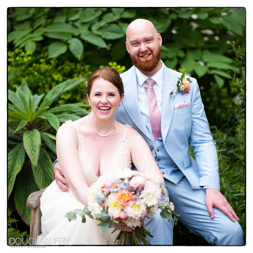 bride and groom outisde in the gardens at Inner Temple in London