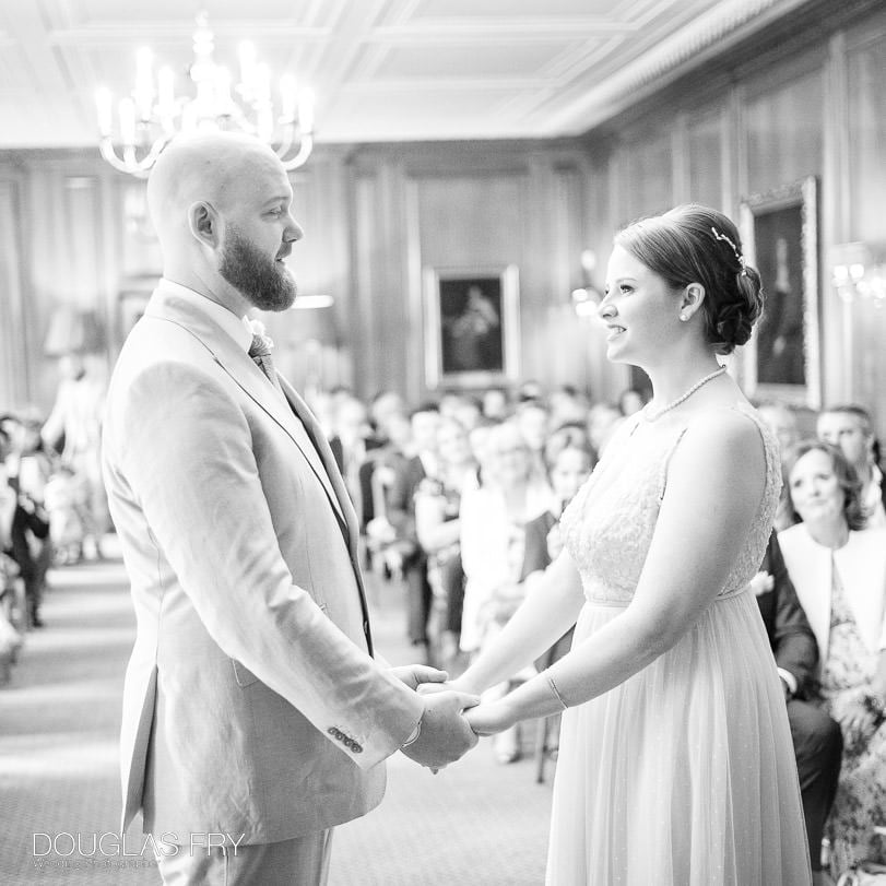 bride and groom exchanging vows at their wedding at Inner Temple in London