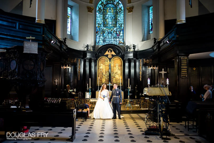 Military Wedding Photographer at St Clements Dane Church and The RAF Club in London 4 St Clement Danes Church - wedding service - bride and groom