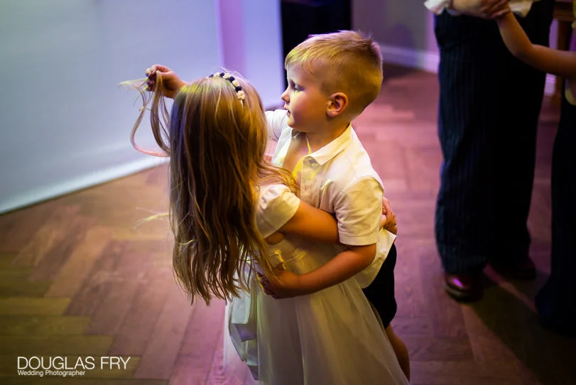 Military Wedding Photographer at St Clements Dane Church and The RAF Club in London 13 children dancing at wedding at RAF Club in London