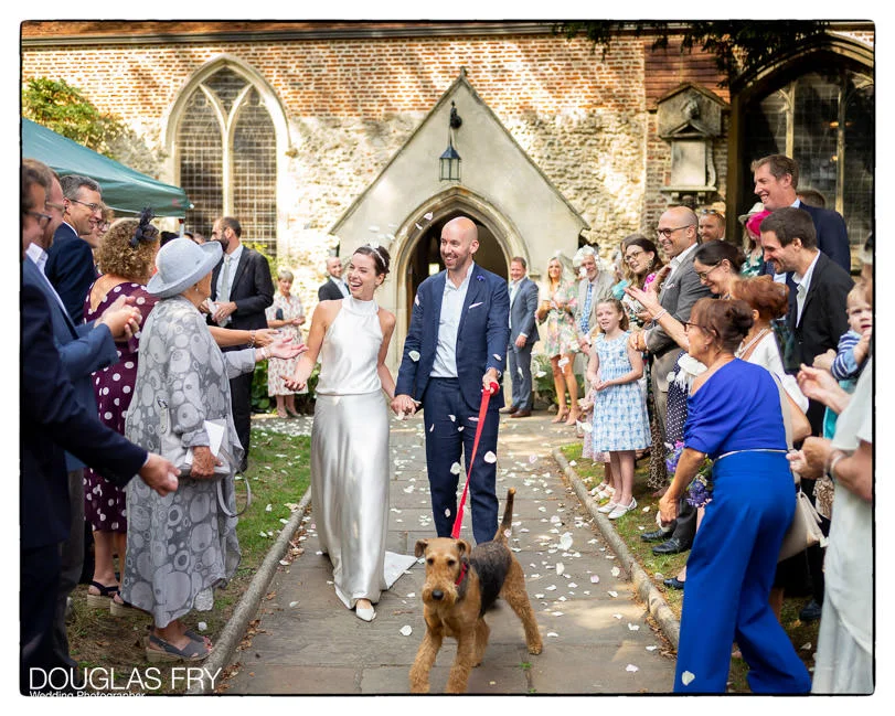 London Wedding Photography in Barnes at Olympic Studios 2 Wedding Photographer in Barnes, London at the church with airedale terrier dog