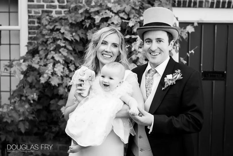 Fulham Palace Summer Wedding Photography 4 couple and baby at wedding reception