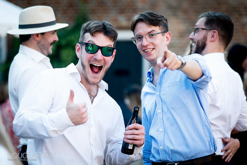 Guests photographed enjoying wedding at Fulham Palace