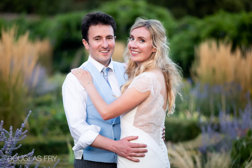 couple photographed together in gardens at Fulham Palace
