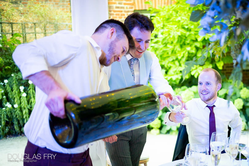 Melchior of wine being poured during London wedding
