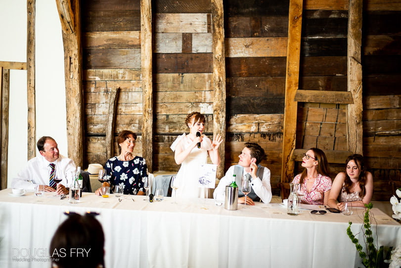 bride photographed giving speach at wedding