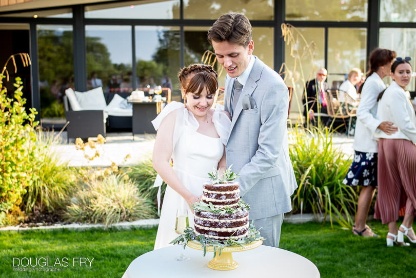 cake cutting wedding photograph in Suffolk