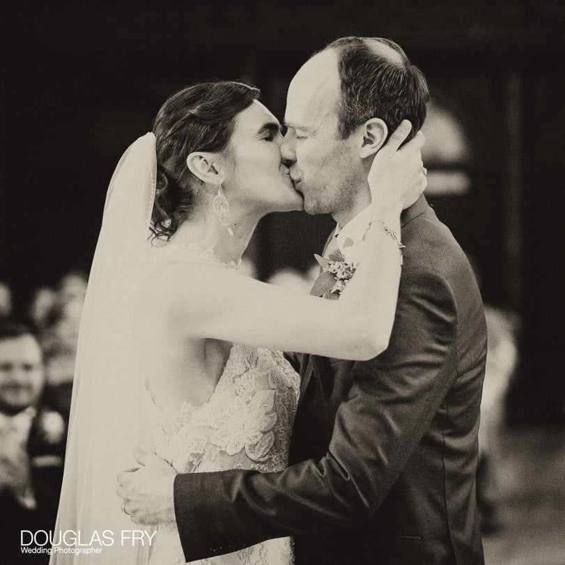 Bride and groom photographed at Gray's Inn in London - kissing