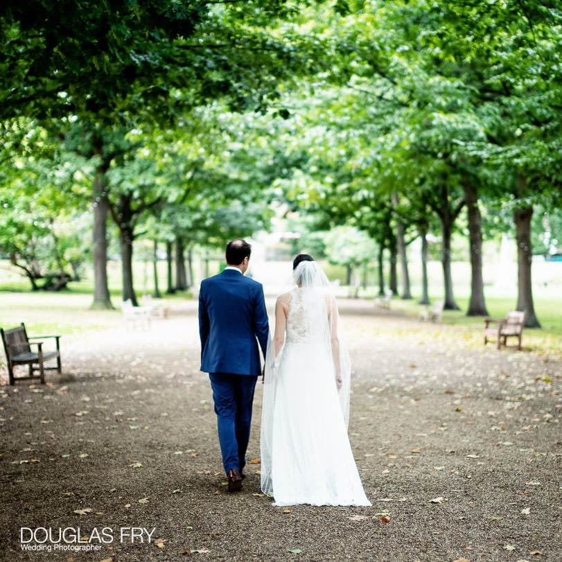 Bride and groom photographed at Gray's Inn in London - Walking together