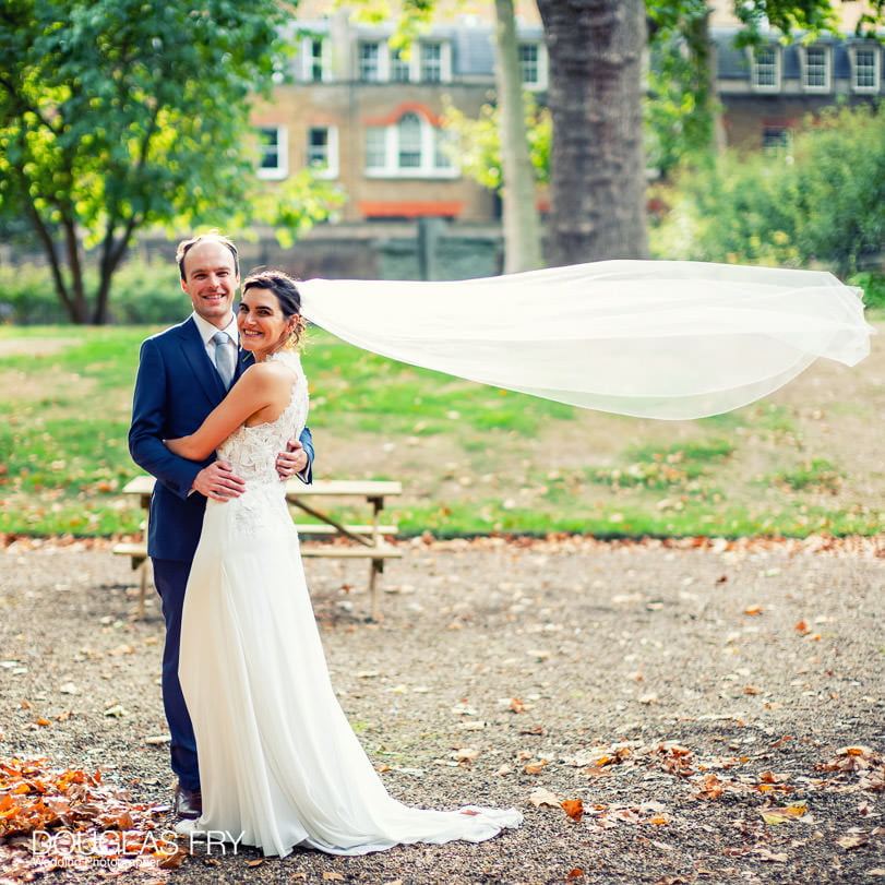 Bride and groom photographed at Gray's Inn in London - with Veil