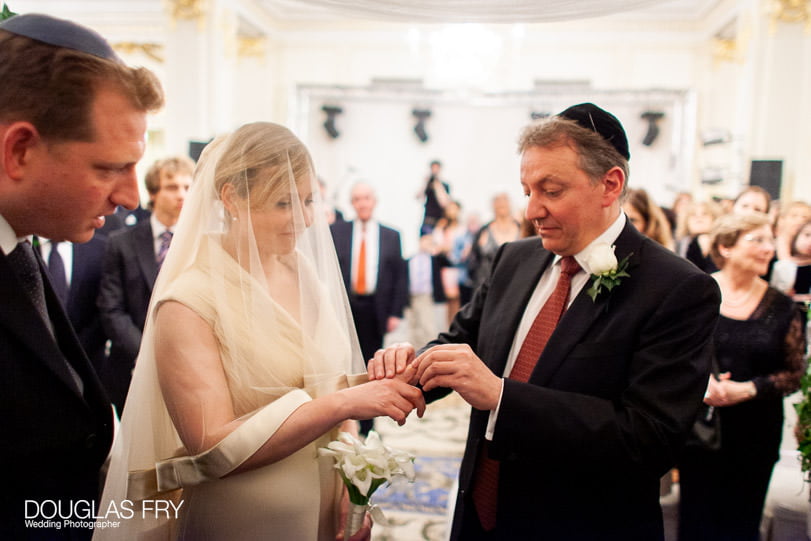 Wedding photographer at Mandarin Oriental - exchanging rings